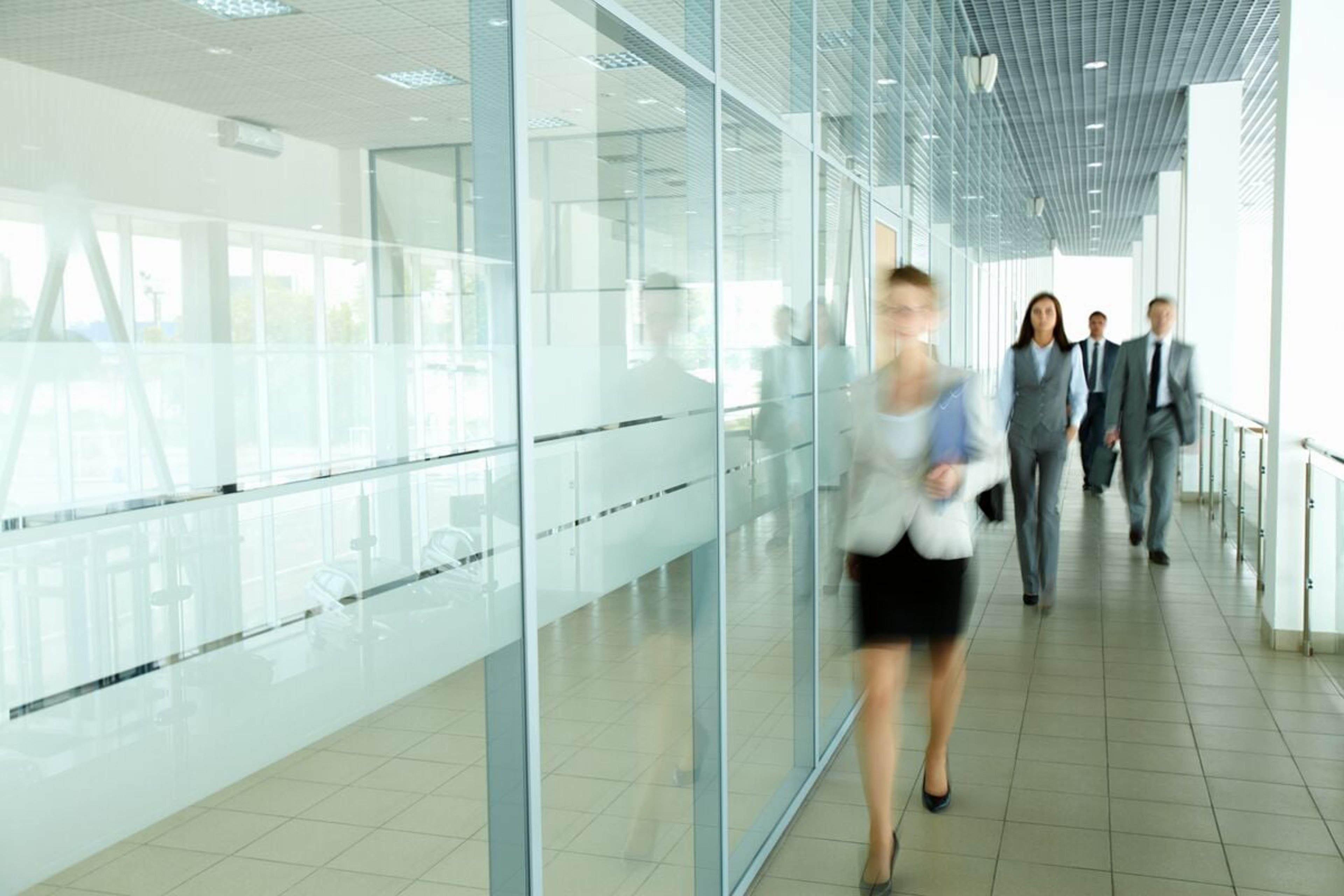 People walking down a corridor